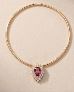 14K yellow gold pink tourmaline and diamond pendant shown on a gold chain