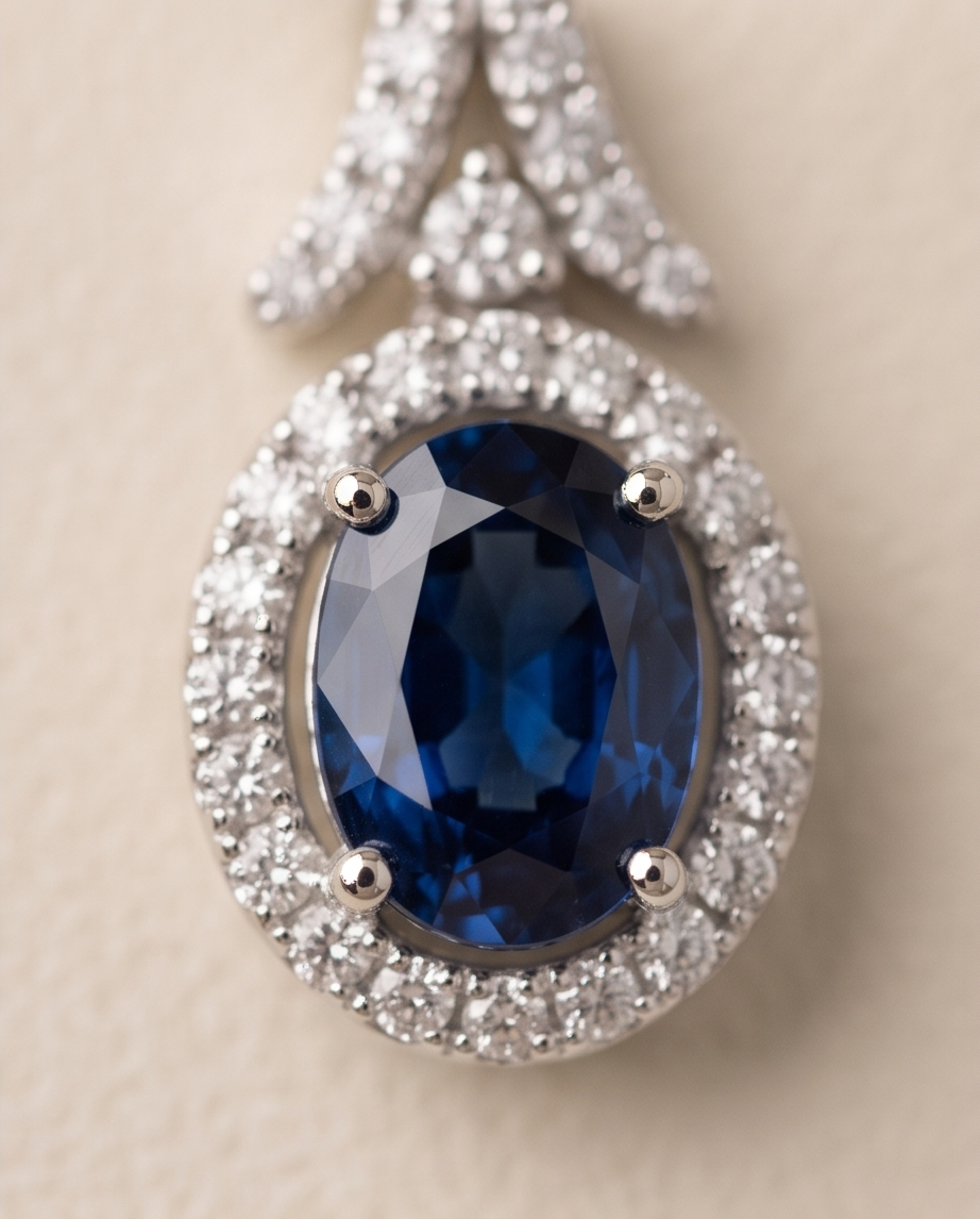 Oval Sapphire & Diamond Halo Earrings in 18kt White Gold