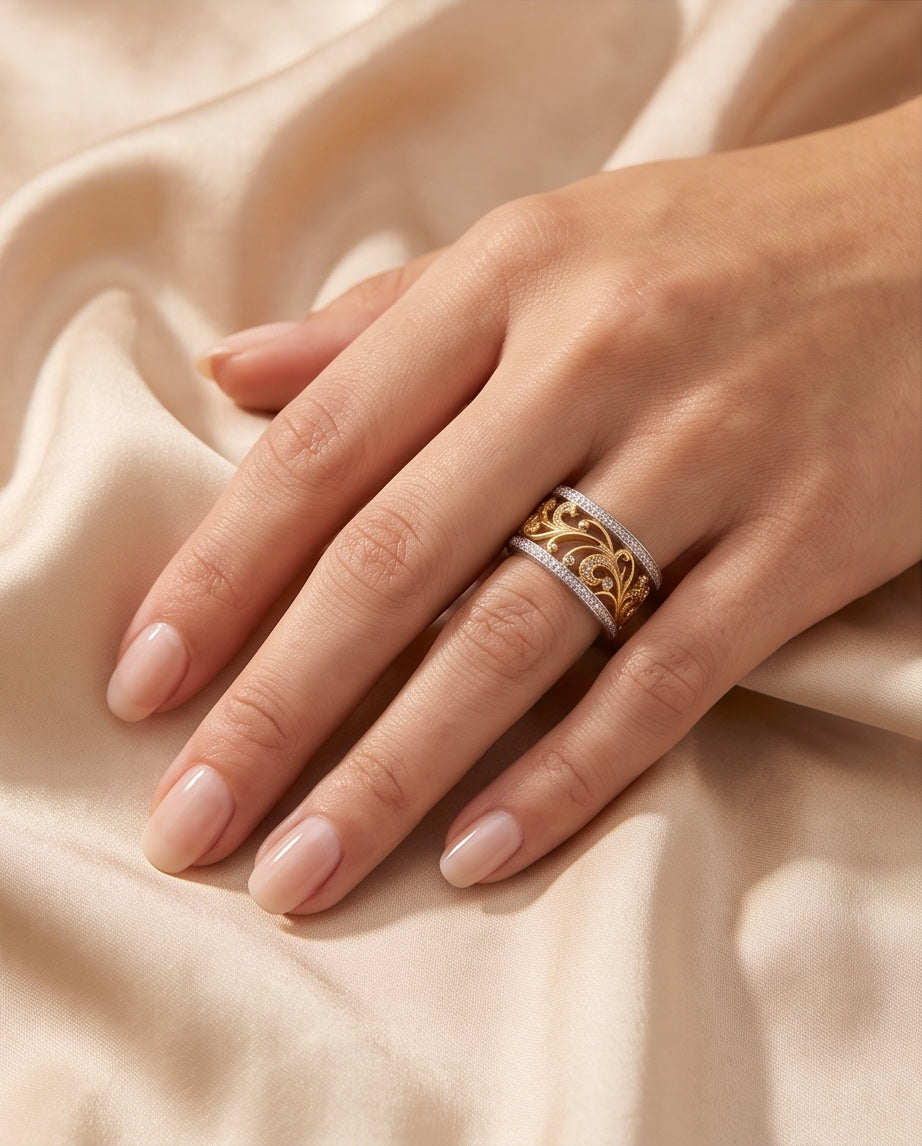 Two-tone diamond scroll band worn on the hand