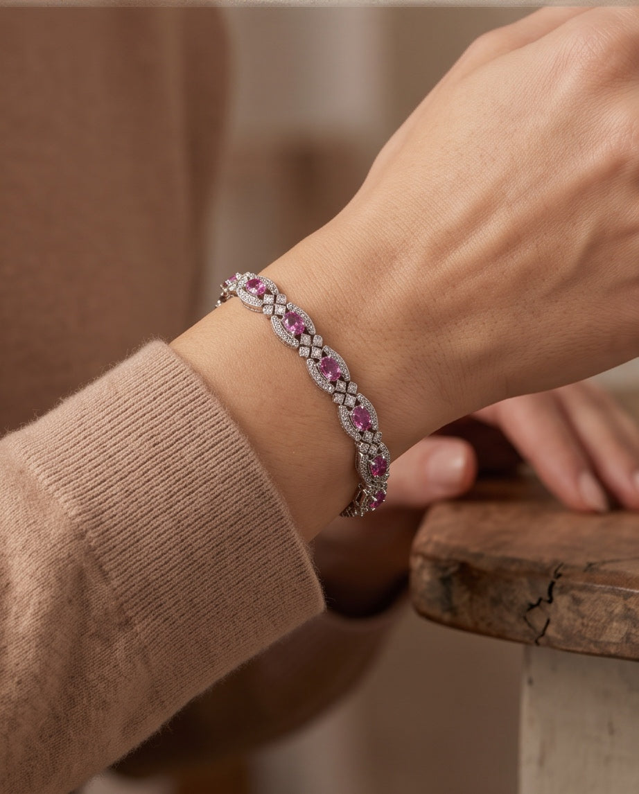 Pink sapphire diamond bracelet worn on the wrist