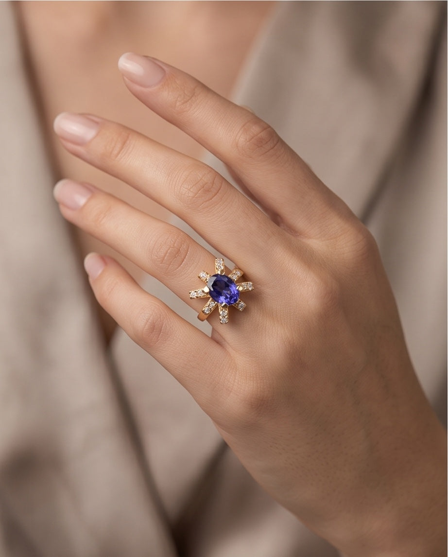 Tanzanite starburst cocktail ring worn on the hand