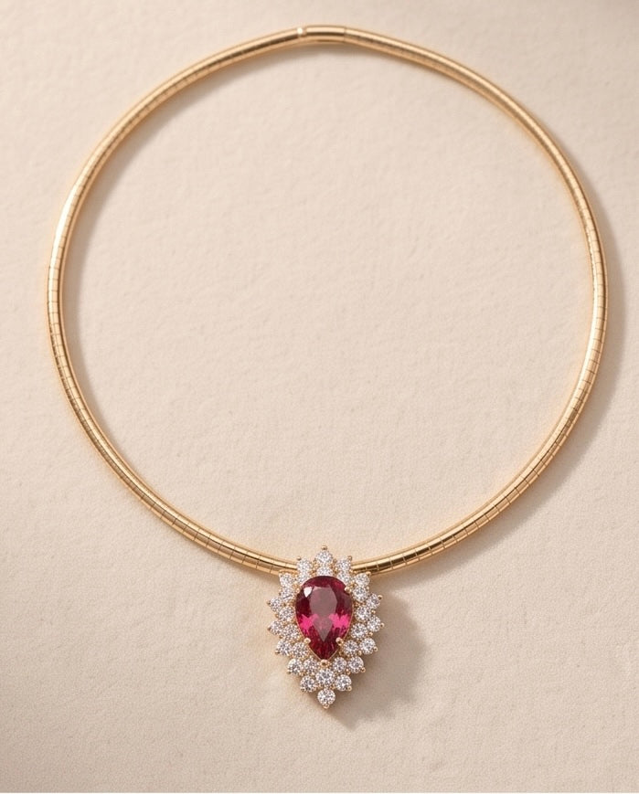 14K yellow gold pink tourmaline and diamond pendant shown on a gold chain