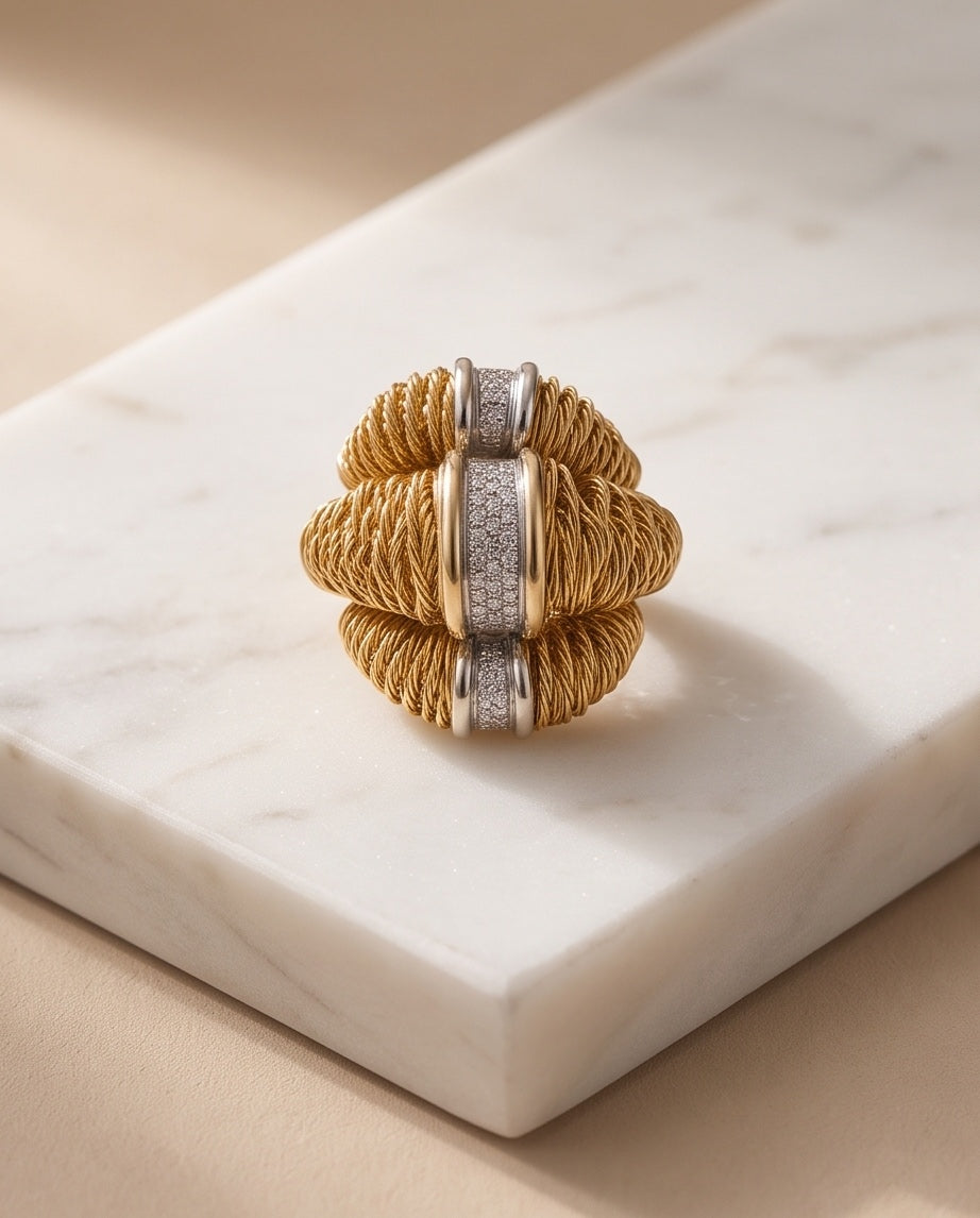 Orlando Orlandini woven 18K gold and pavé diamond ring on marble