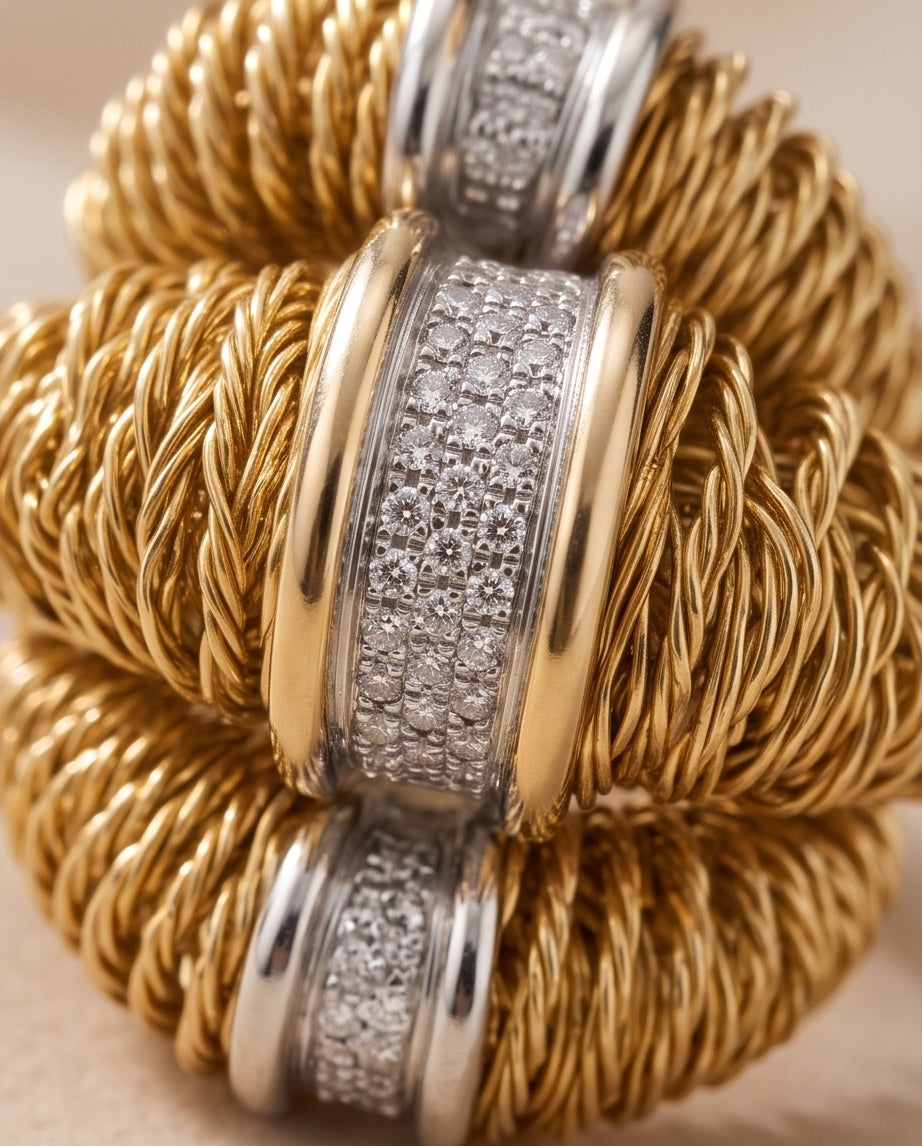 Close-up of pavé diamonds and braided 18K gold mesh, Orlando Orlandini ring