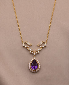 14K gold ornate diamond and teardrop amethyst halo necklace, front view