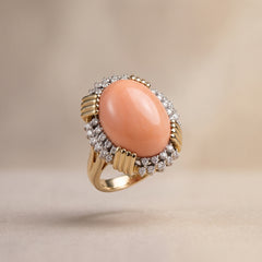 Angel skin coral and diamond ring in 14kt gold, floating studio shot