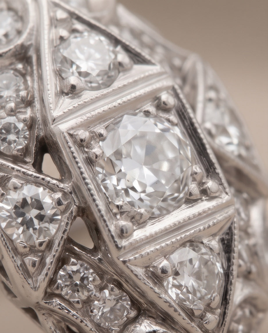 Close-up of center diamond and milgrain detail