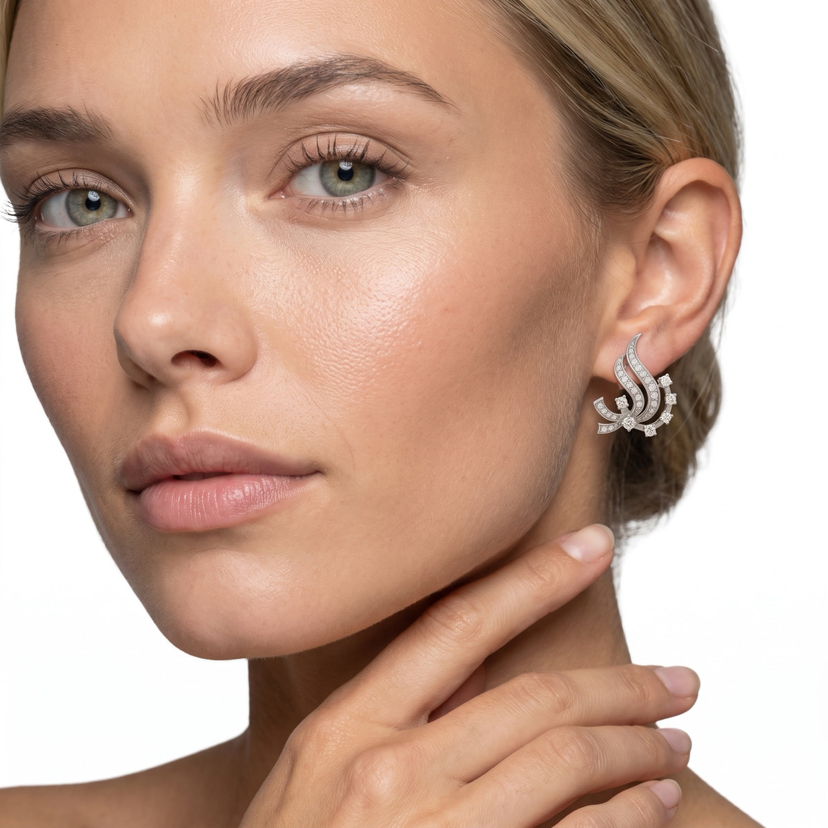 Diamond swirl earring worn on model