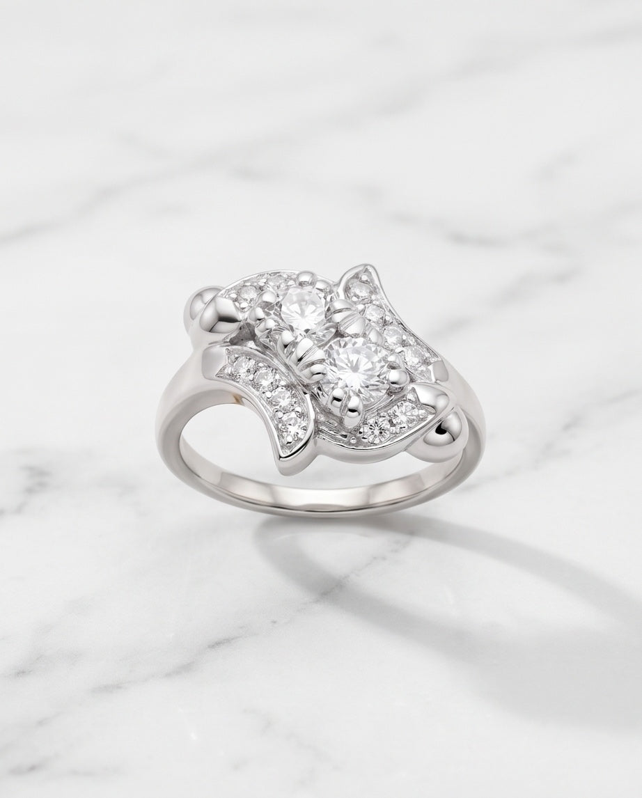 Estate 14K white gold two-stone diamond ring on marble