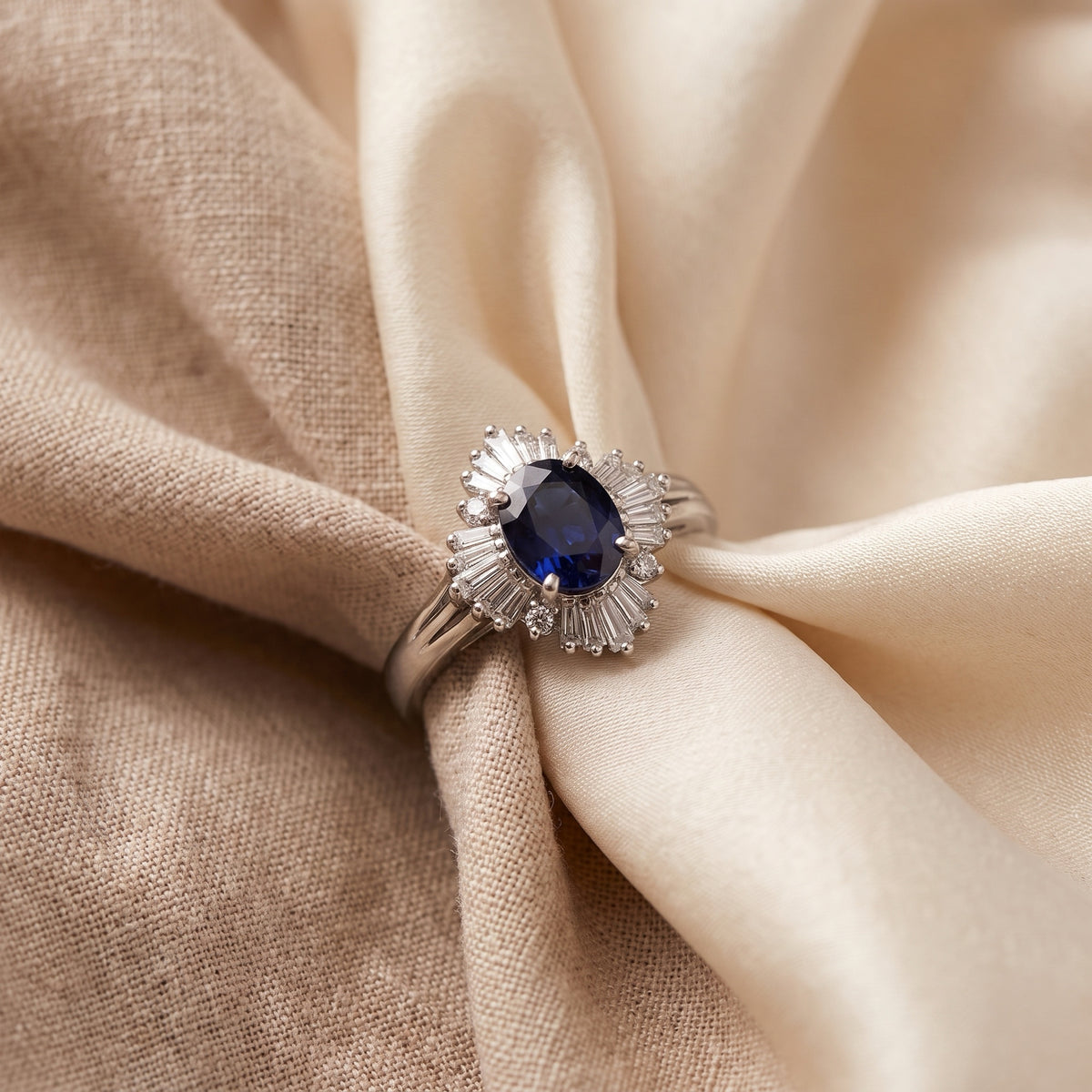 Platinum blue sapphire ballerina diamond ring on silk fabric