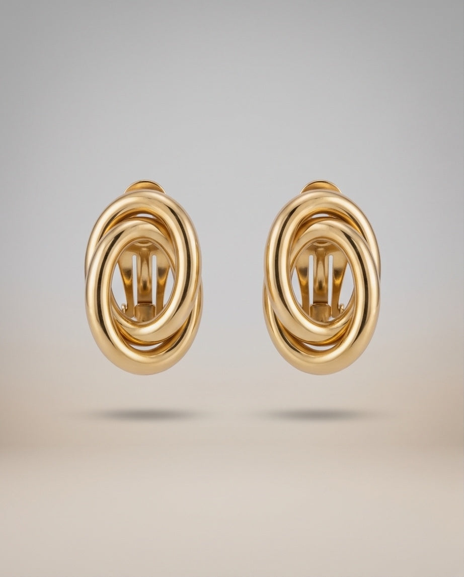 18kt yellow gold swirl earrings front view showing omega clip backs