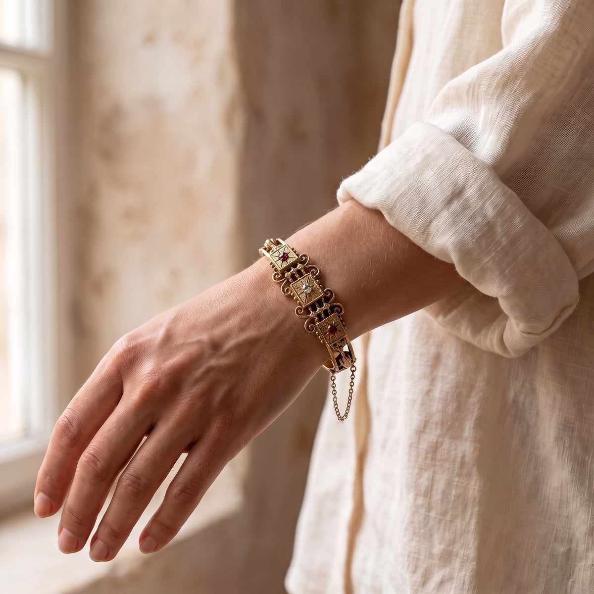Antique 14kt gold ruby and diamond bangle bracelet styled on wrist