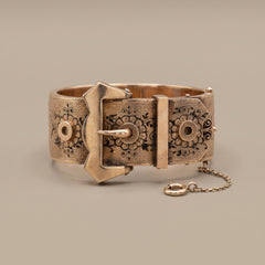 Victorian rose gold buckle bangle with taille d'epargne enamel, studio shot