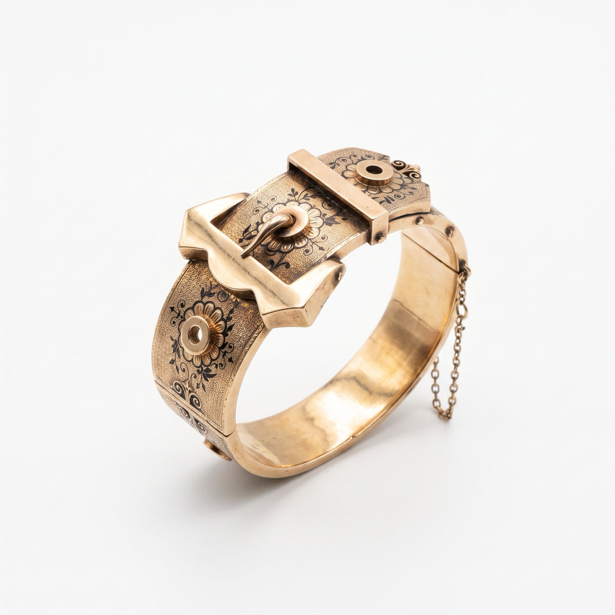Angled view of Victorian rose gold buckle bangle with safety chain