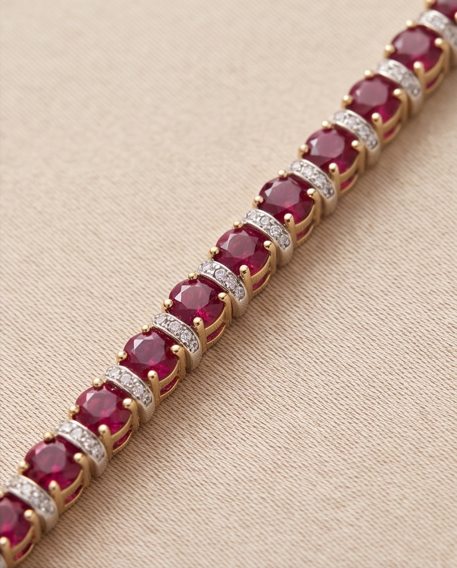 Close-up of prong-set rubies with pave diamond bar spacers