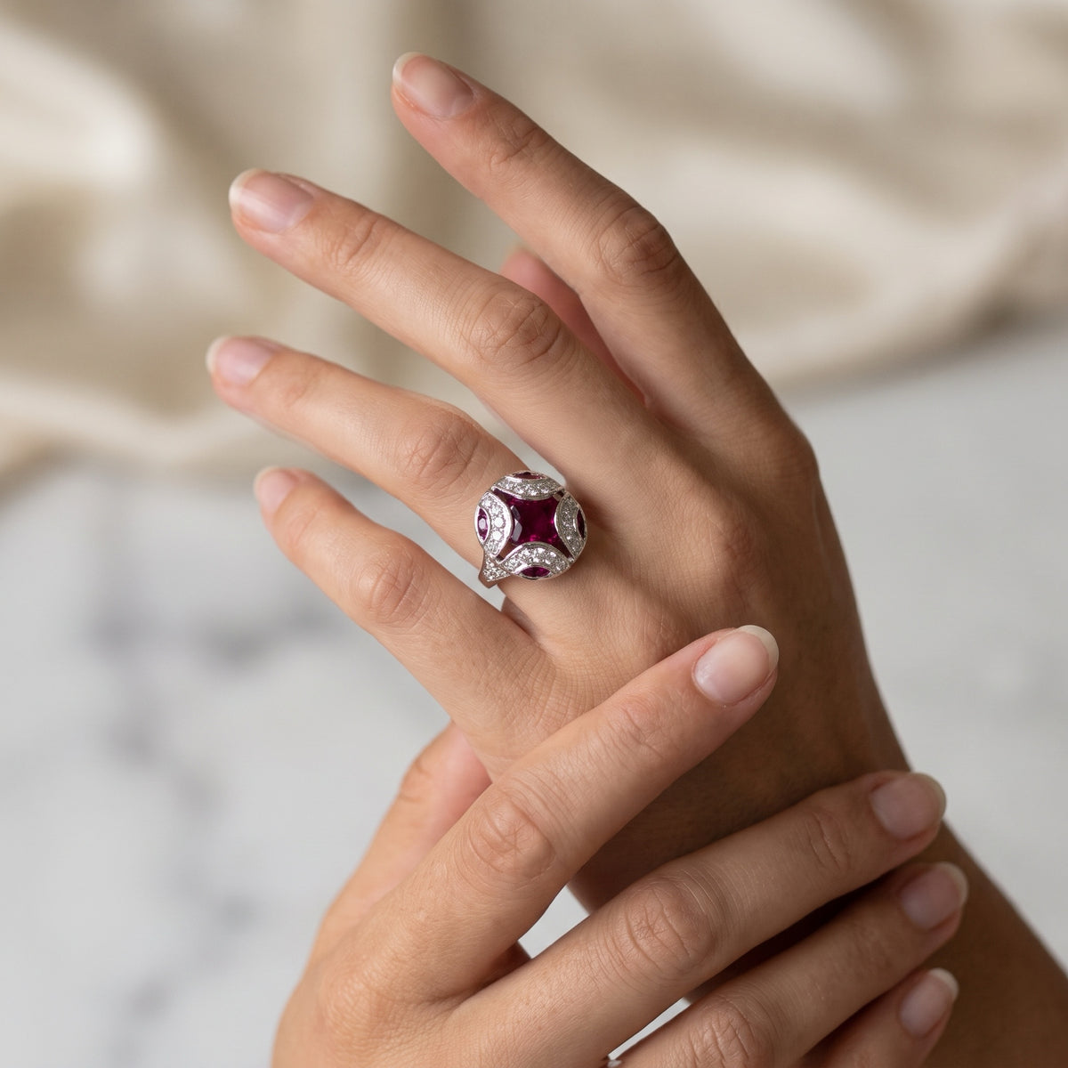 Ruby and diamond ring on model's hand