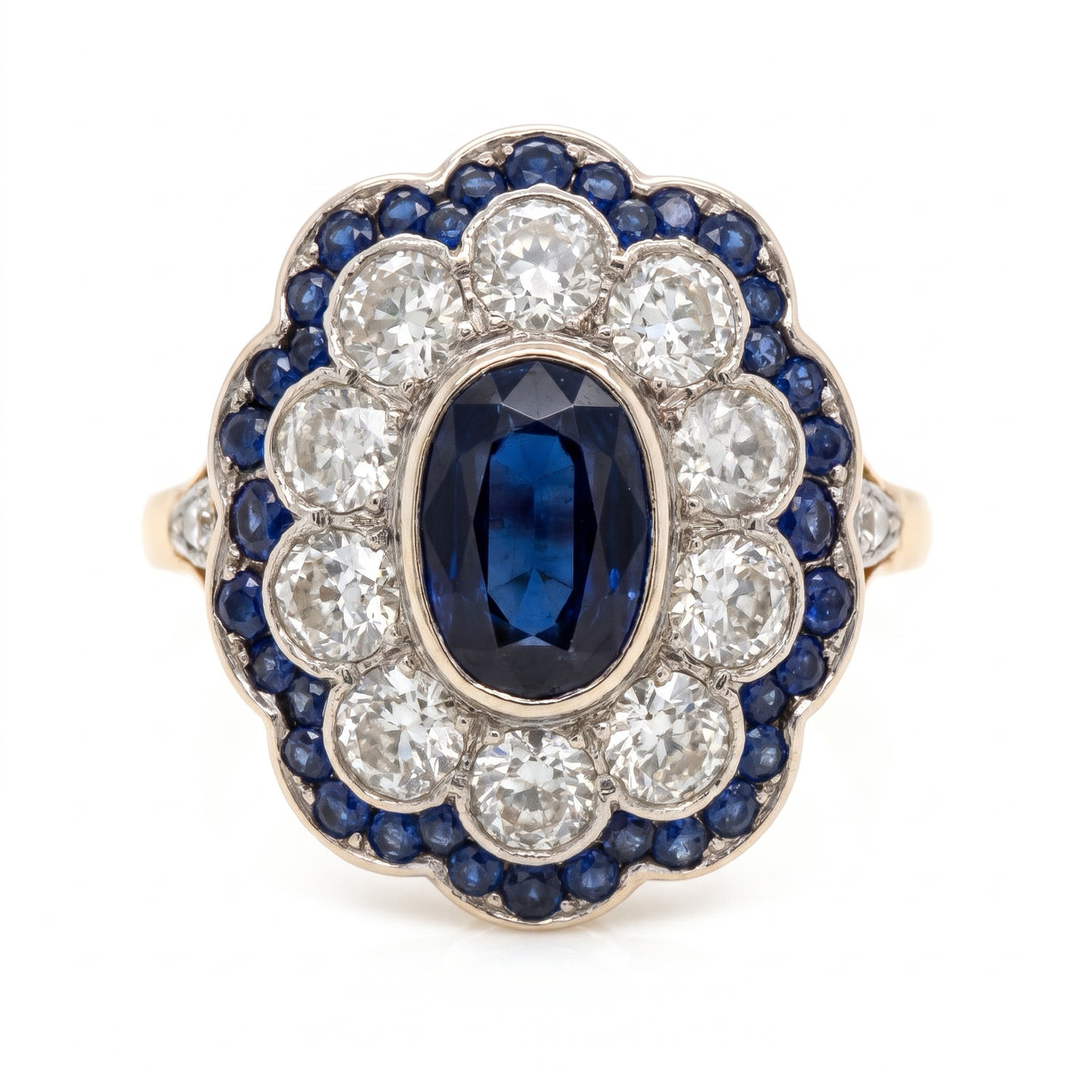 Antique sapphire and old-cut diamond cluster ring, studio shot on white
