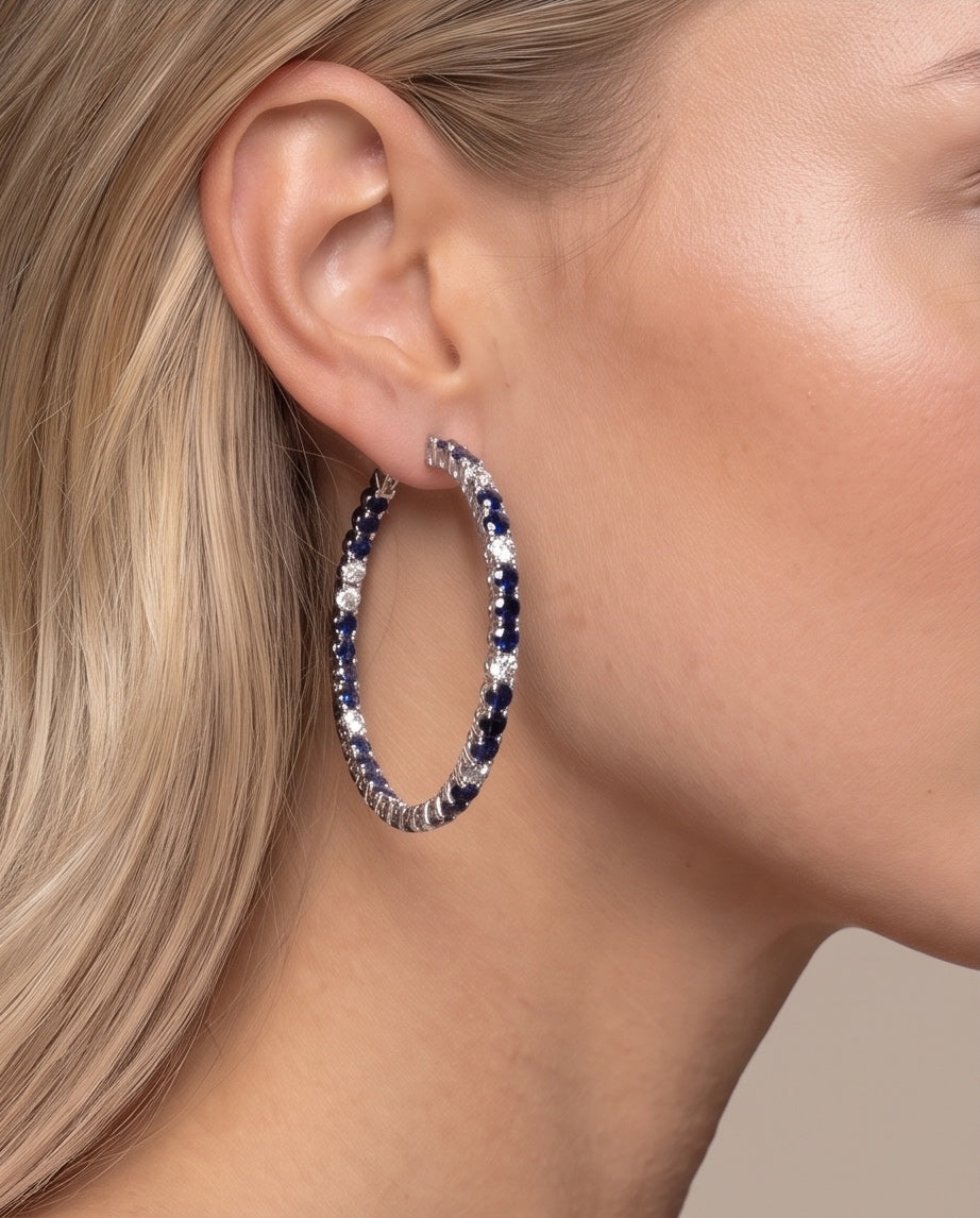 Sapphire and diamond hoop worn on the ear, close-up