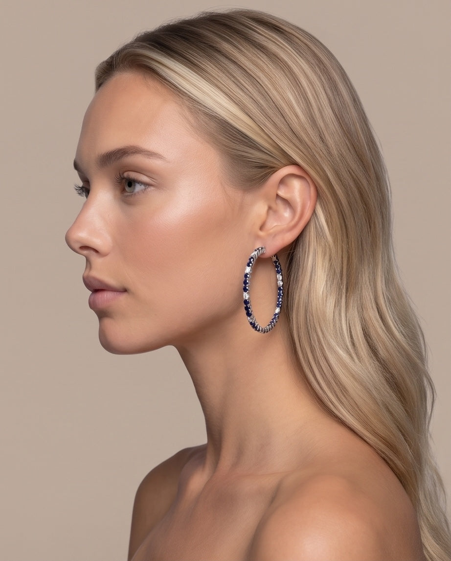 Sapphire and diamond hoops worn on model, profile view
