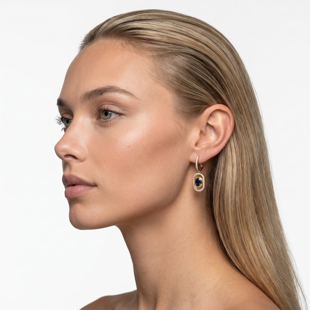 Sapphire and diamond drop earrings worn on model